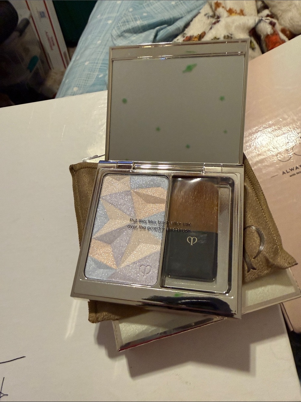 cle de peau Radiant Duo Highlighter Compact in Champagne and Pale Blue